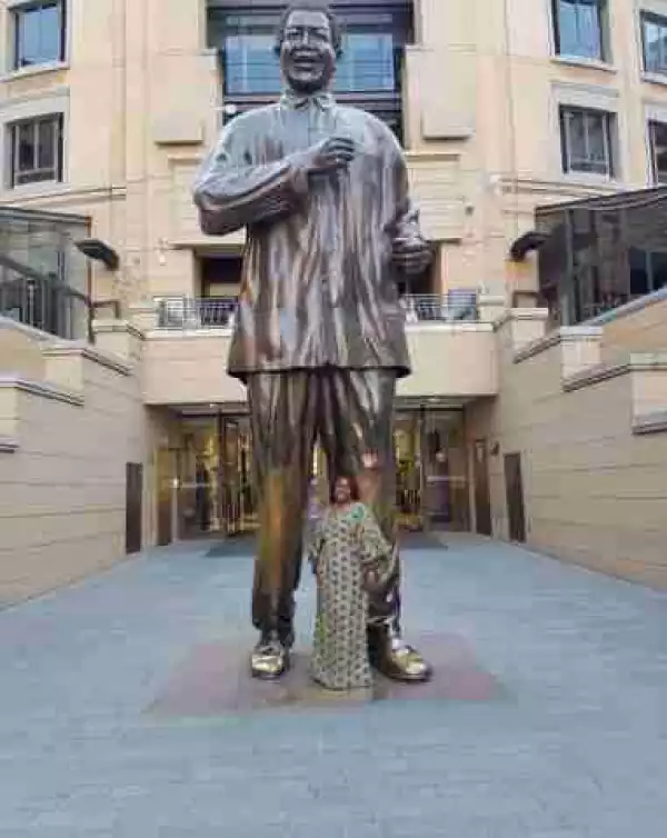 Actress Joke Silva Poses With Nelson Mandela Giant Statue